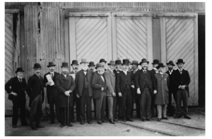 Councillor Evans, fourth from left in 1900 – outside the Adelaide Rd tram barns on municipalisation  of  tramways.  Wellington City Archives 00138:0:8703 