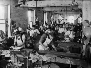 The interior of Wycherley’s saddle manufactory in Willis Street may well have looked like this one in Auckland in 1906. [Alexander Turnbull Library FL325203] 